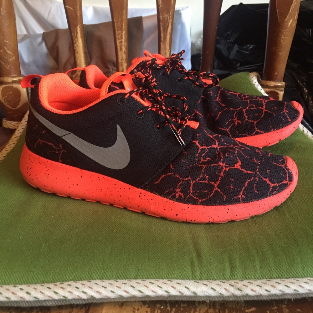 Black and pink/orange Nike roshes
